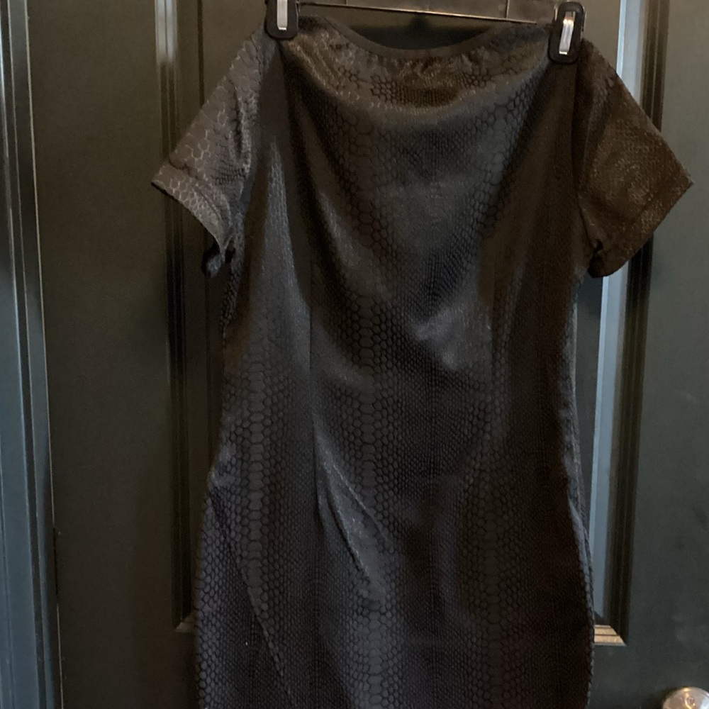Whitney Eve Black Dress
Asymmetrical Hem
Size S 
Fitted